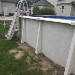 Above ground pool with safety ladder